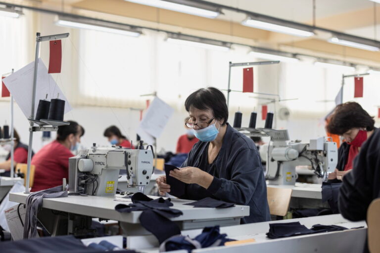 Workers sew cloths at the Jugotex textile factory in Smederevo