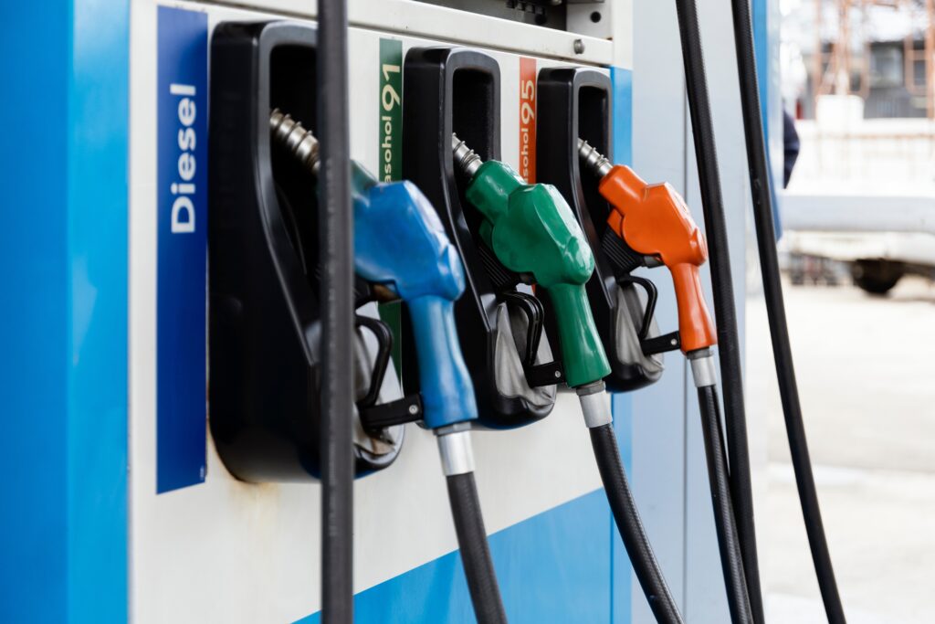 Fuel,Pump,Nozzles,In,Blue,,Green,And,Orange,For,Diesel,